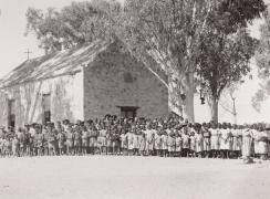 Growing congregation in front of the church